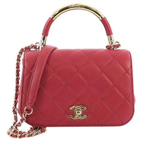 chanel new small carry chic flap bag|Chanel small lambskin evening bag.